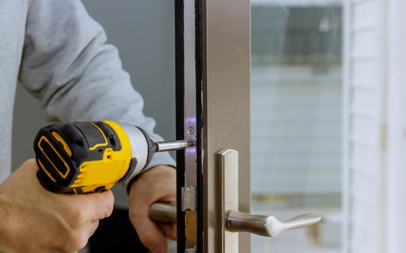 locksmith-in-installing-new-house-door-lock-hand-h-2021-08-29-01-07-52-utc.jpg